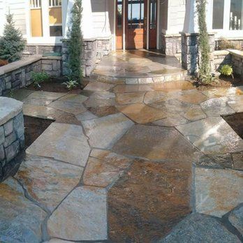 Stone veneer porch columns and flagstone entry built for a Newport, Oregon home