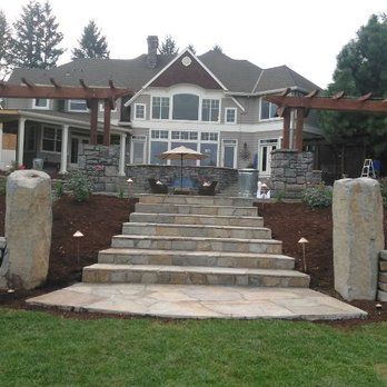 Grand natural stone entry staircase with pillars built by Steve Smith Masonry in Lincoln County, Oregon