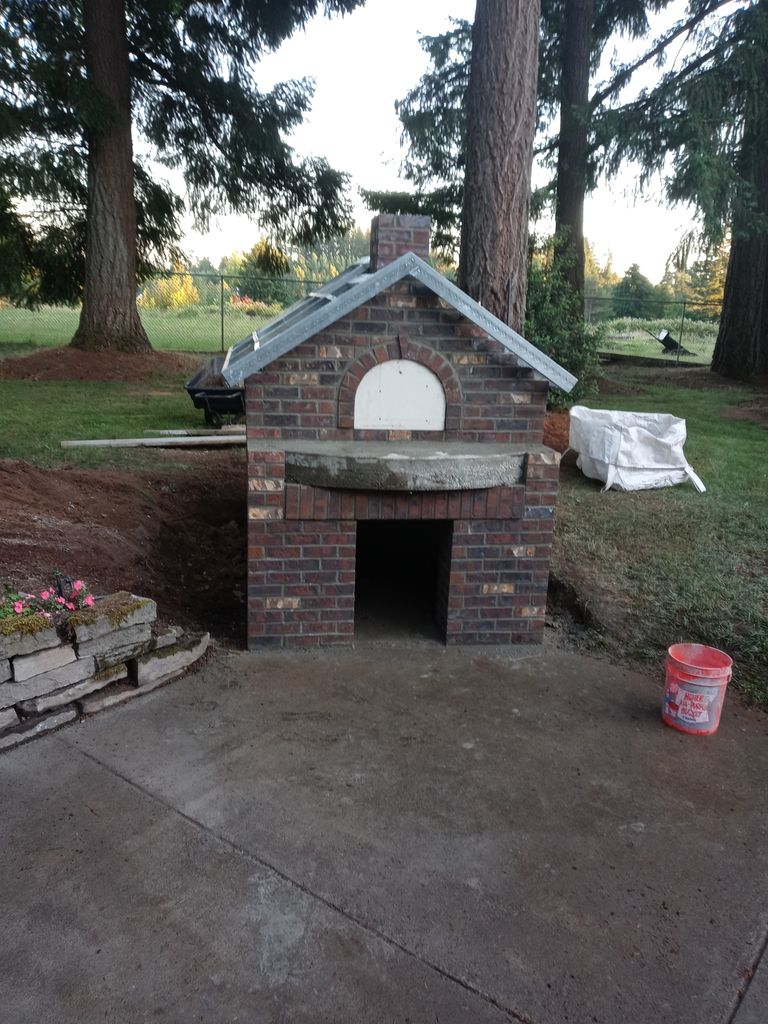 Brick outdoor fireplace and oven built for a Lincoln County, Oregon backyard