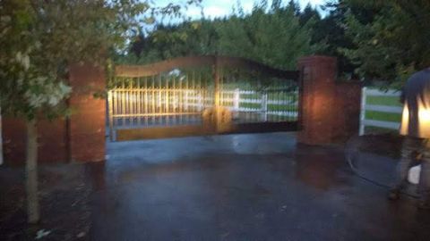 Brick entry pillars with an iron gate built near Newport, Oregon