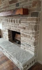 Stone veneer fireplace surround built in Newport, Oregon